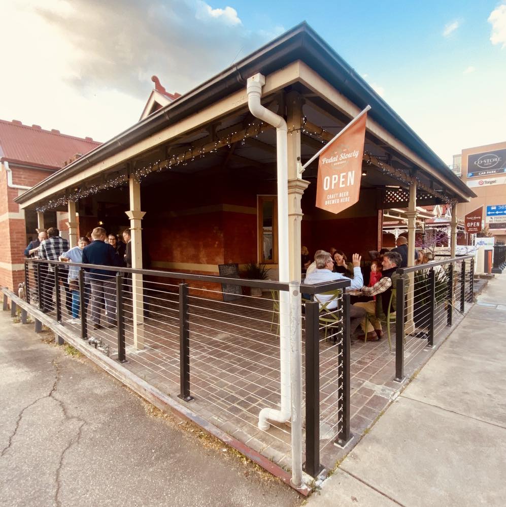 Pedal Slowly brewhouse exterior with guests